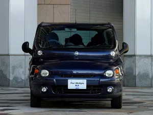 Vintage Fiat Multipla In Classic Townscape Wallpaper