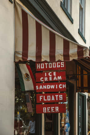 Vintage Food Signs Under Striped Awning Wallpaper