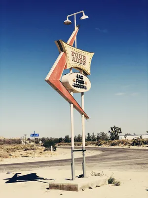 Vintage Four Aces Gas Station Sign Wallpaper