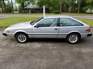 Vintage Isuzu Impulse Side View Wallpaper