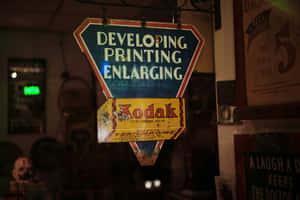 Vintage Kodak Film Developing Sign Wallpaper