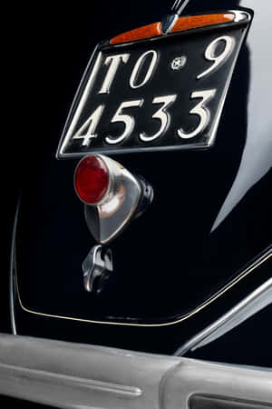 Vintage Lancia Aprilia License Plateand Tail Light Wallpaper