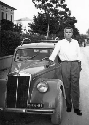 Vintage Lancia Apriliawith Man Standing Wallpaper