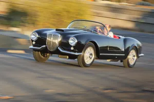 Vintage Lancia Aurelia B24 Convertiblein Motion Wallpaper