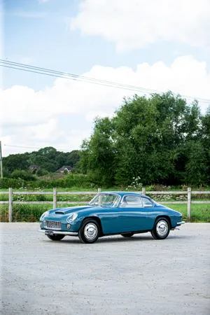 Vintage Lancia Flaminia Coupe Parked Outdoors Wallpaper