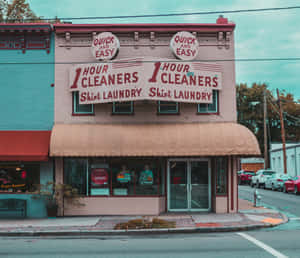 Vintage Laundry Signson Building Facade Wallpaper