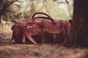 Vintage Leather Duffel Bagin Nature Wallpaper