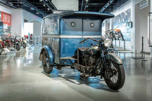 Vintage Motorcycleand Delivery Vanat Petersen Automotive Museum Wallpaper