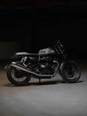 Vintage Motorcyclein Dark Backdrop Wallpaper