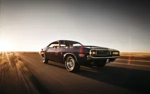 Vintage Muscle Car Speedingon Highway.jpg Wallpaper