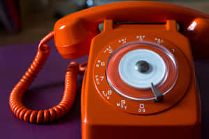 Vintage Orange Rotary Phone Wallpaper