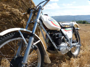 Vintage Ossa Motorcyclein Field Wallpaper