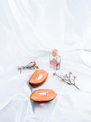 Vintage Peach Perfumeand Slices Still Life Wallpaper