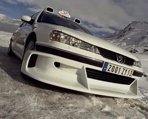 Vintage Peugeot 406 Speeding On A Sunny Day Wallpaper