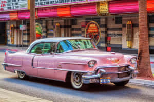 Vintage Pink Cadillac In Pristine Condition Wallpaper