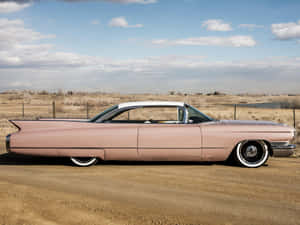 Vintage Pink Cadillac Shining In All Its Glory Wallpaper