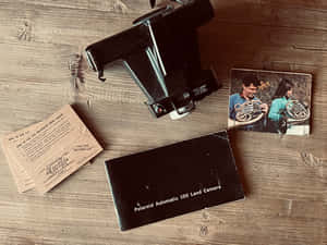 Vintage Polaroid Cameraand Photo Wallpaper