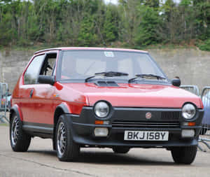 Vintage Red Fiat Ritmo In Its Prime Wallpaper