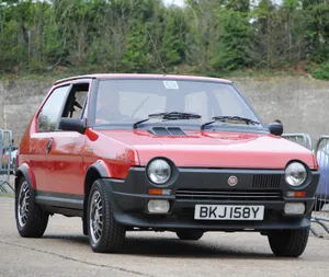 Vintage Red Fiat Ritmo In Its Prime Wallpaper