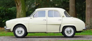 Vintage Renault Dauphine Standing In The Spotlight Wallpaper