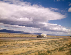 Vintage Road Trip Through Desert Wallpaper