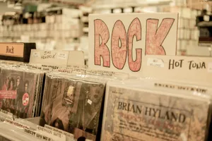 Vintage Rock Record Shop Scene Wallpaper