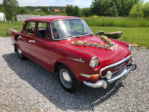 Vintage Skoda1000 Mb Decorated With Flowers Wallpaper