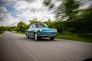 Vintage Skoda1000 Mb On The Road Wallpaper