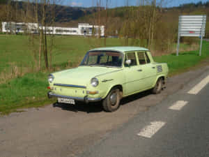 Vintage Skoda1000 Mb Parked Roadside Wallpaper