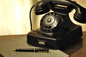 Vintage Telephoneand Penon Desk.jpg Wallpaper