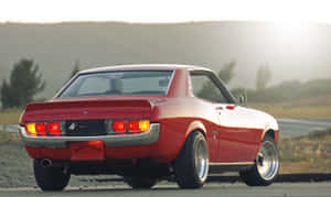 Vintage Toyota Celica Back View Sunset Wallpaper