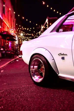 Vintage Toyota Celica Nighttime Street Wallpaper