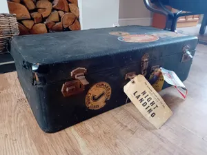 Vintage Travel Suitcasewith Stickersand Tags Wallpaper