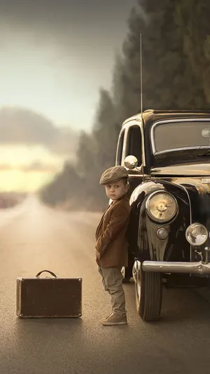 Vintage Traveler Child With Suitcase Wallpaper