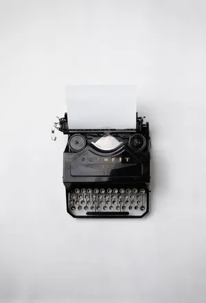 Vintage Typewriter On A Desk Wallpaper