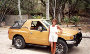 Vintage Yellow Isuzu Amigo With Woman Wallpaper