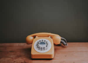 Vintage Yellow Rotary Phone Wallpaper