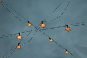 Visible Lights Against Gray Sky Wallpaper