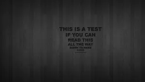 Vision Test On Dark Grungy Wooden Background Wallpaper
