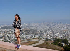 Visitor Overlooking San Francisco From Twin Peaks Wallpaper