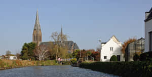 Vlaardingen Canal Viewwith Church Wallpaper