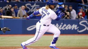 Vladimir Guerrero Jr Swinging A Bat Wallpaper