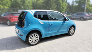 Volkswagen Up Blue Side View Parked Wallpaper