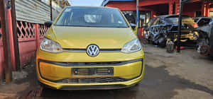 Volkswagen Up Yellow Front View Wallpaper