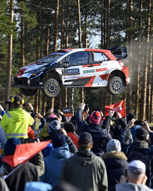 W R C Rally Car Jump Spectators.jpg Wallpaper