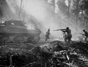 W W2 Infantryand Tank Advancing Through Forest Wallpaper