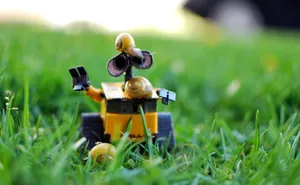 Wall E Toy With Snails Wallpaper
