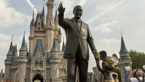 Walt Disney And Mickey Disneyworld Statue Wallpaper