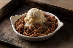 Warm And Enticing Winter Desserts Displayed On A Rustic Wooden Table. Wallpaper