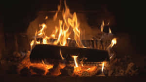 Warm And Inviting Fireplace Scene Wallpaper